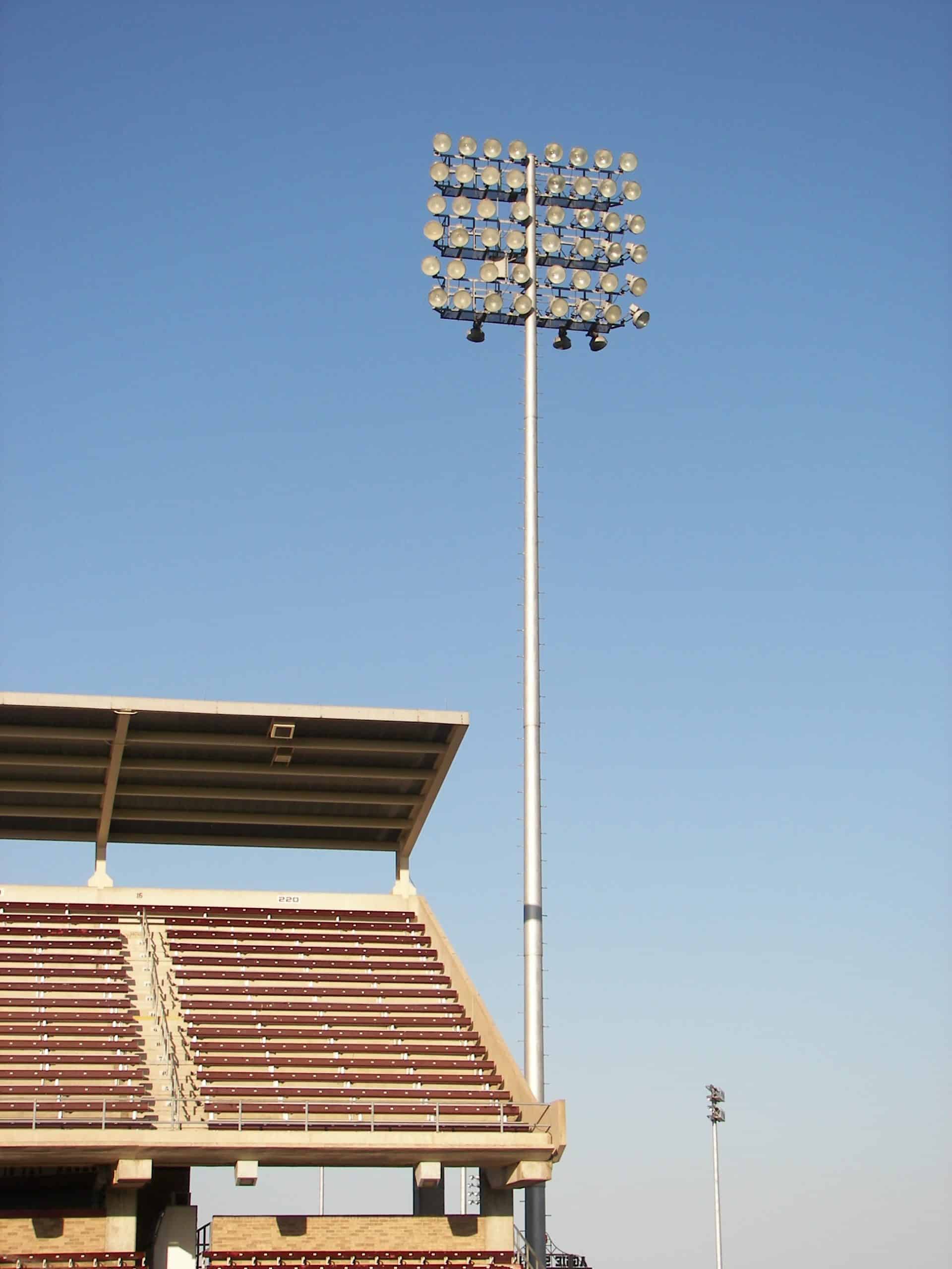 High-powered floodlights illuminating outdoor stadiums.