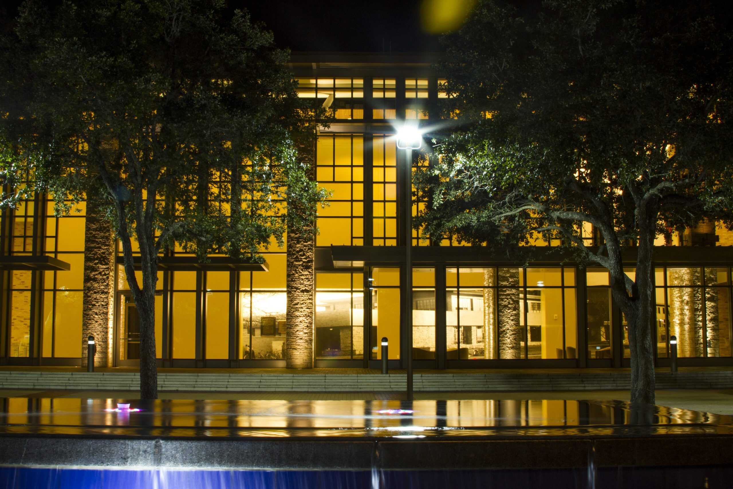 Modern commercial building illuminated with energy-efficient outdoor lighting by Britt Rice Electric, L.P.