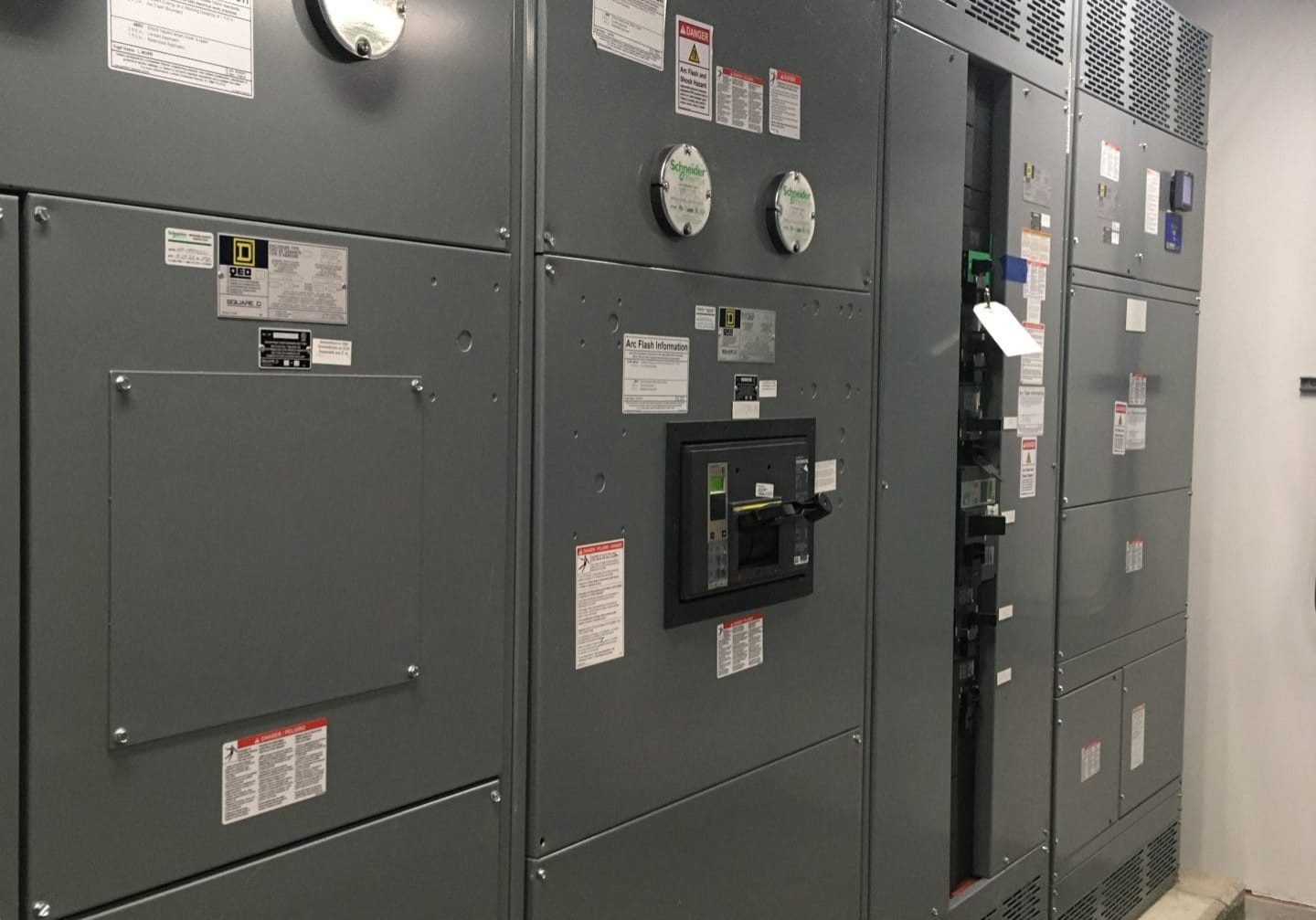 High-quality electrical panel featuring safety labels, circuit breakers, and control units for industrial electrical systems.